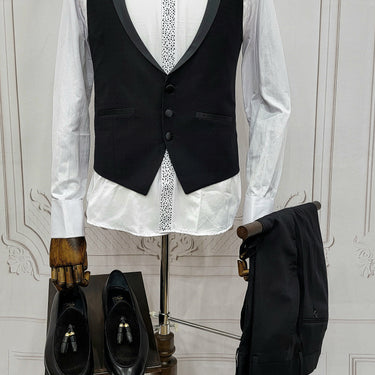 Single Button Three Pieces Tuxedo Suit with Black satin Lapel, matching bow tie and black dress pants.