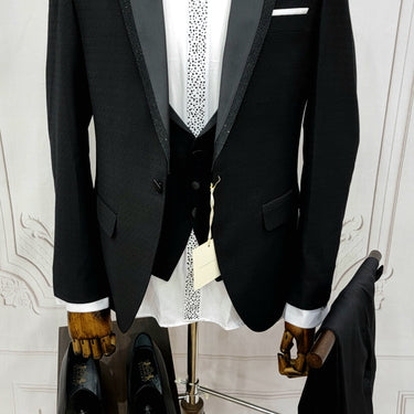Single Button Three Pieces Tuxedo Suit with Black satin Lapel, matching bow tie and black dress pants.