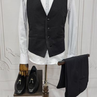 Three Pieces Tuxedo Suit with a Classic Black Satin Lapel, matching bow tie and Black Pants.