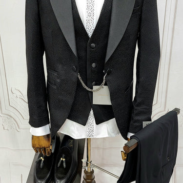 Three Pieces Tuxedo Suit with a Classic Black Satin Lapel, matching bow tie and Black Pants.