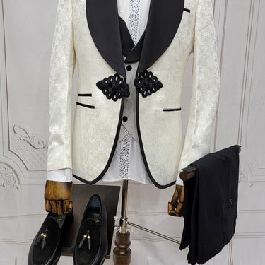 Three Piece Tuxedo Suit with Contrasting Black Lapel, matching bow tie and Black Pants. white knot