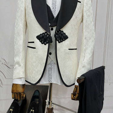 Three Piece Tuxedo Suit with Contrasting Black Lapel, matching bow tie and Black Pants. white knot
