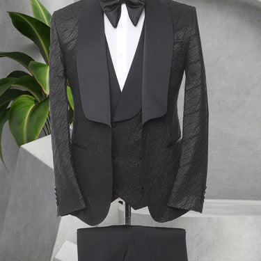 Three Pieces Tuxedo Suit with a Satin Lapel, matching bow tie and Black Pants.